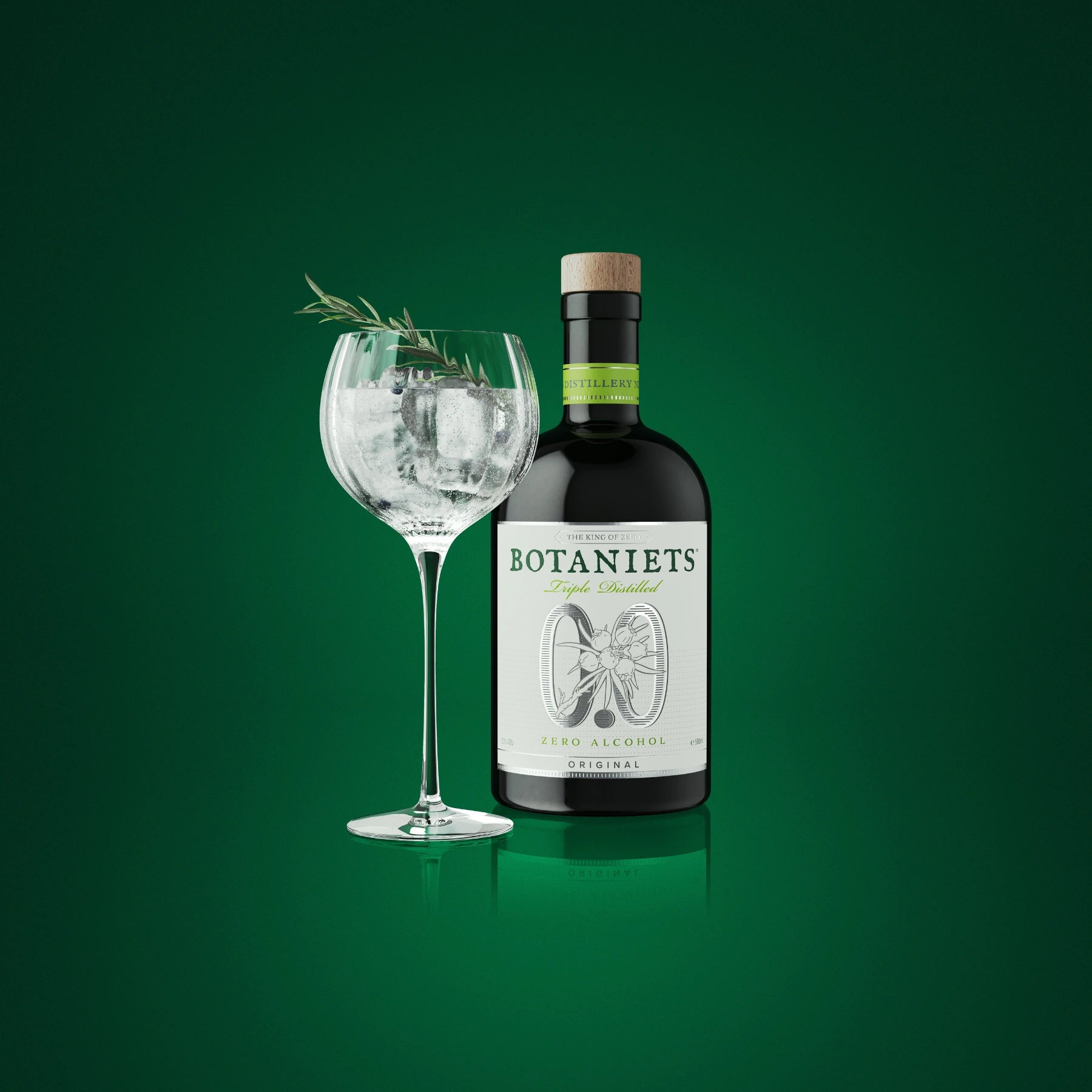 Botaniets Original alcohol-free botanical spirit served with tonic, ice and rosemary garnish in a large glass.