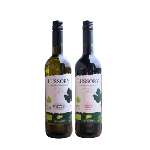 Two bottles of Lussory organic non-alcoholic wine, Chardonnay White and Merlot Red, displayed side by side on a neutral background.