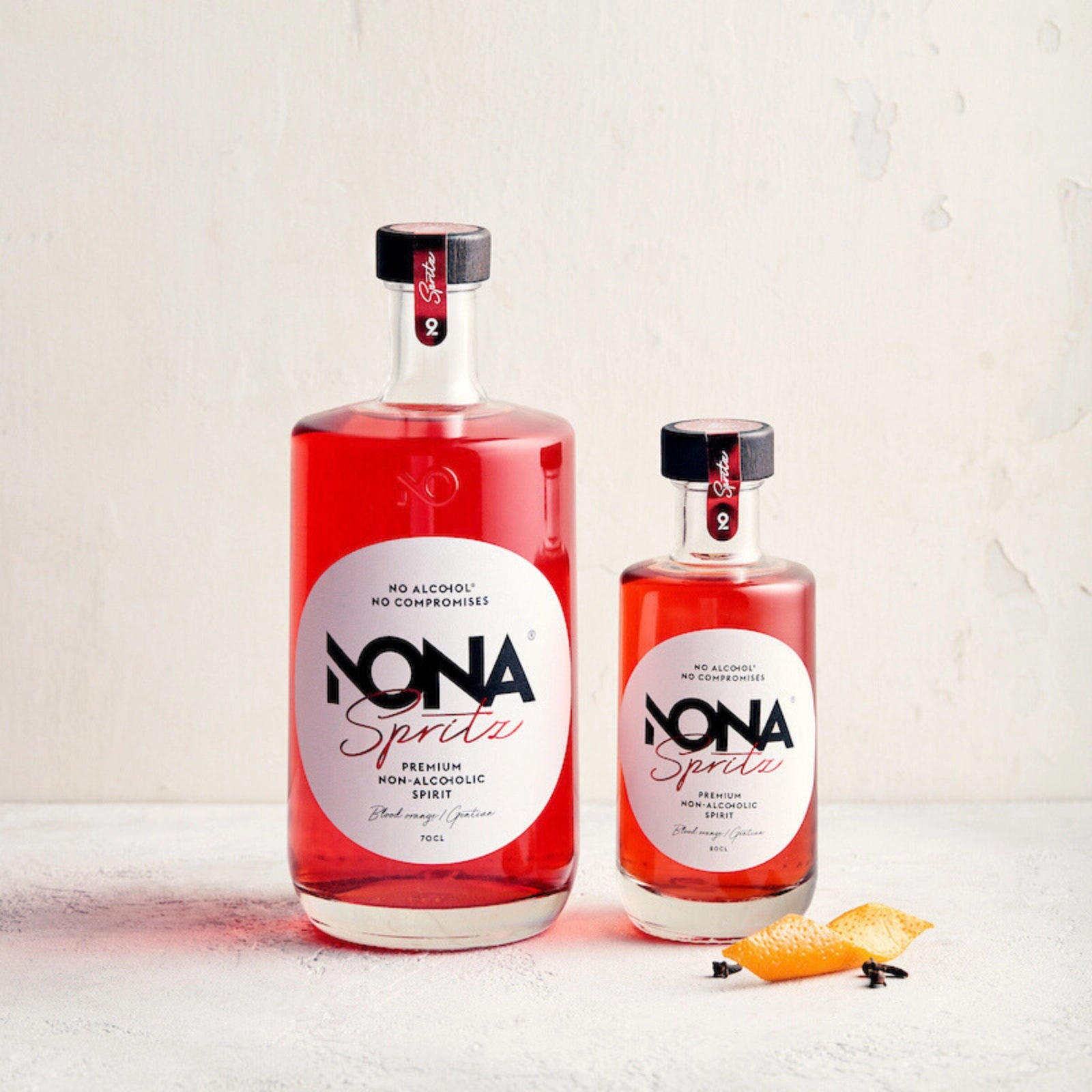 Two bottles 700 ml and 200 ml of NONA Spritz on a light background