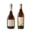 Two bottles of Prima Pavé non-alcoholic wine — Grand Cuvée sparkling and Bianca D'Or white — on a neutral background.