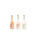 Three mini bottles of Prima Pavé alcohol-free sparkling wine: Rosé Dolce, Rosé Brut, and Blanc de Blancs, arranged on a neutral backdrop.