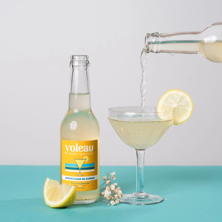 Yoleau elderflower spritz mocktail poured into a glass with lemon garnish, alcohol-free spritz drink.
